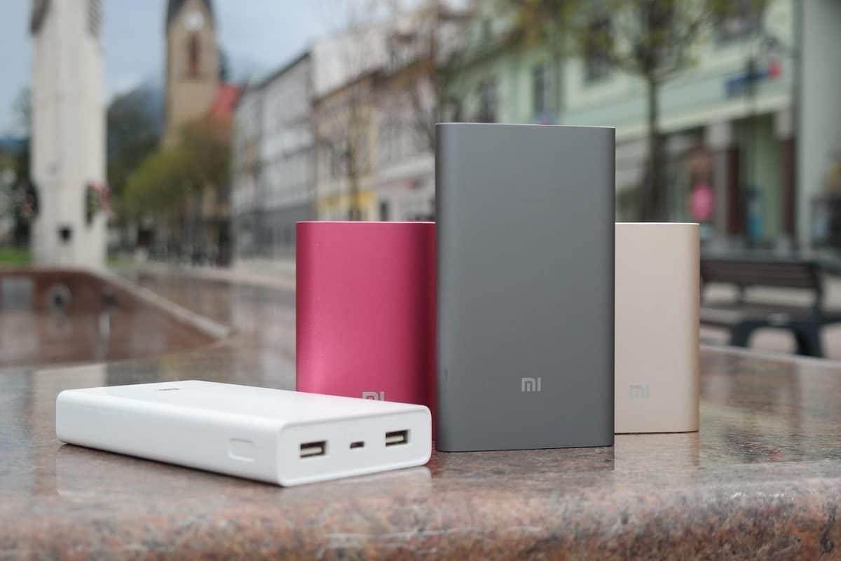 Different portable power banks sitting on a wall outdoors.
