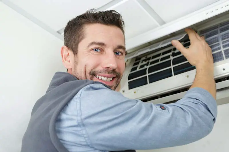 Man working on air conditioner