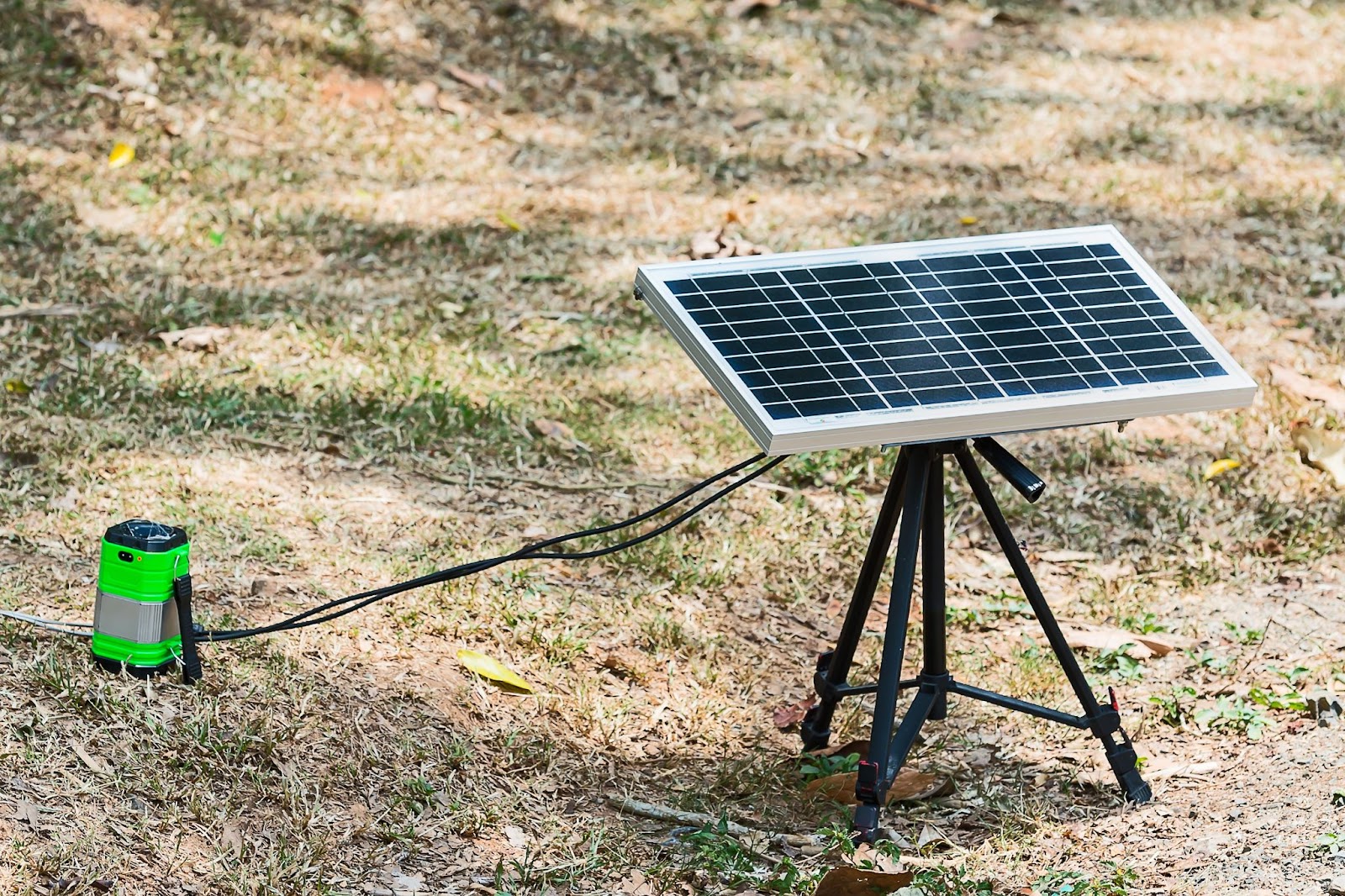 Outdoor small tripod with solar panel and connection cord